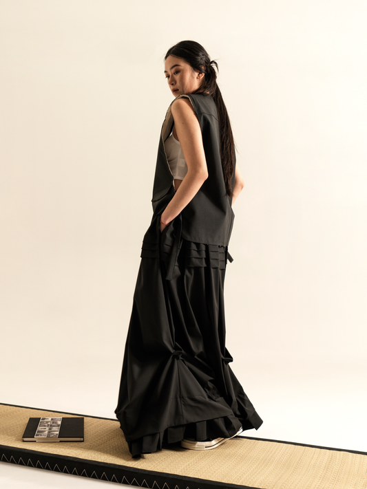 LONG SKIRT WITH SIDE DRAPING AND PLATED RUFFLE HEM