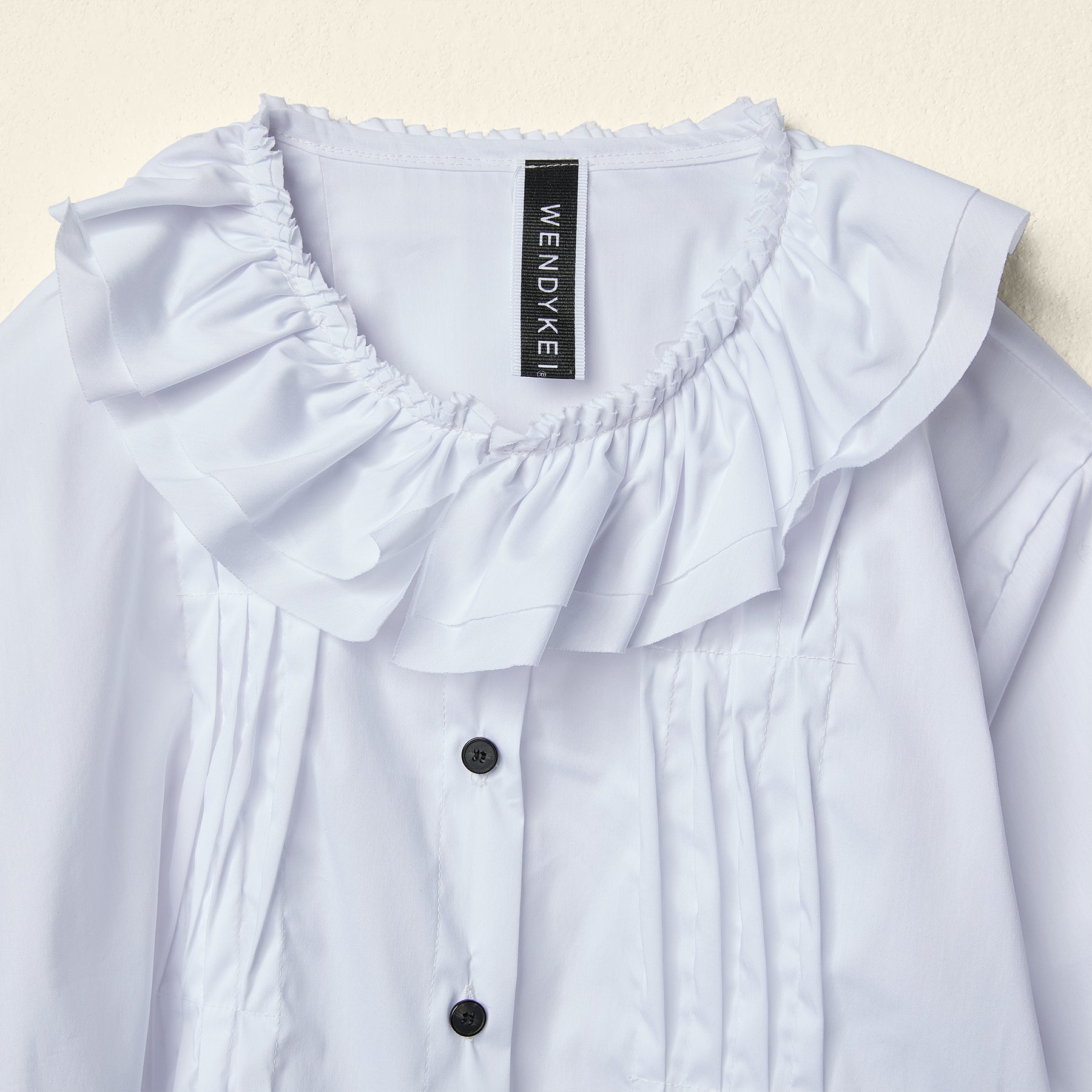 SHIRT WITH ROUCHE ON THE NECKLINE