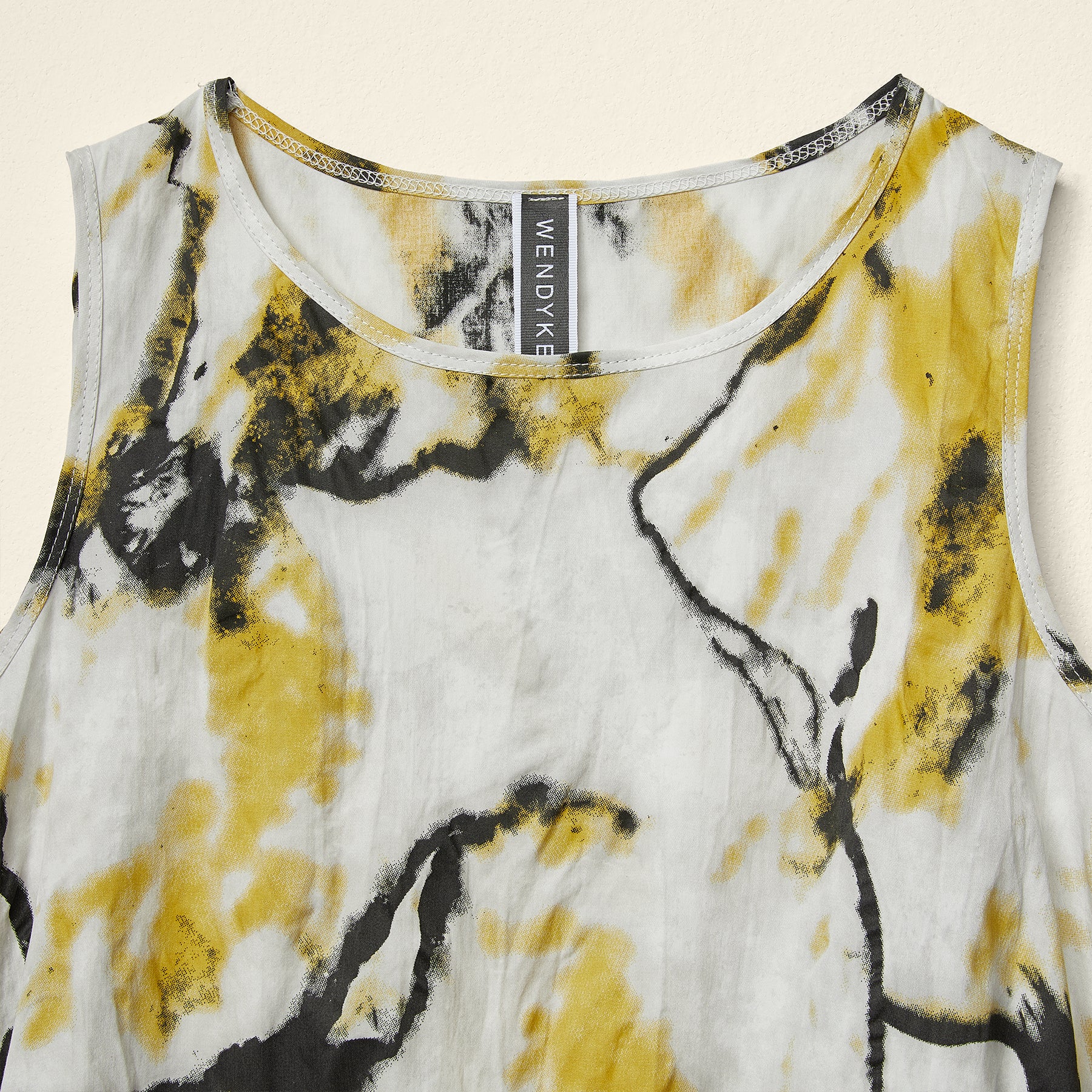 ASYMMETRIC TOP WITH YELLOW FLOWERS