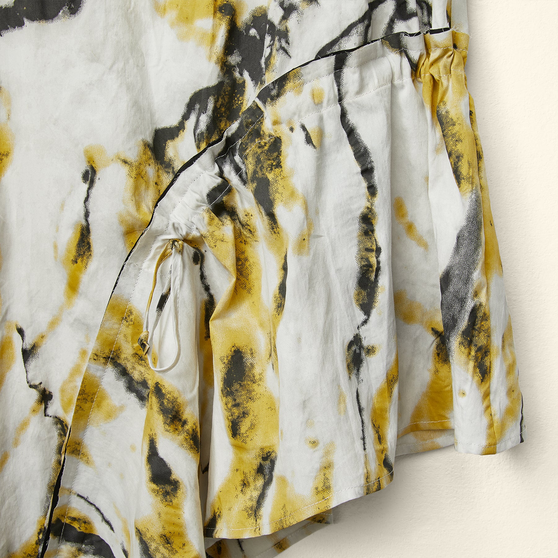 ASYMMETRIC TOP WITH YELLOW FLOWERS