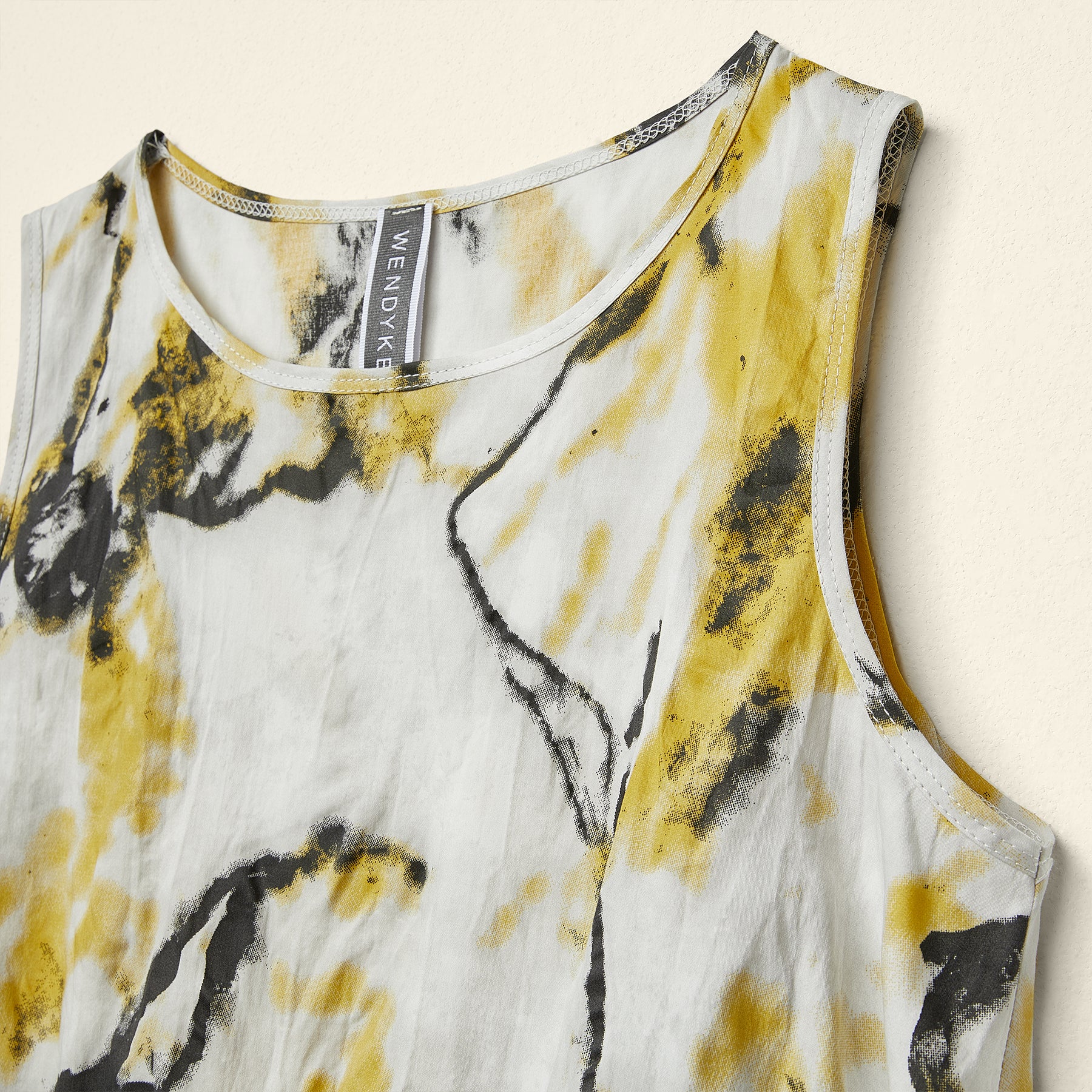 ASYMMETRIC TOP WITH YELLOW FLOWERS