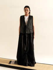 LONG SKIRT WITH SIDE DRAPING AND PLATED RUFFLE HEM