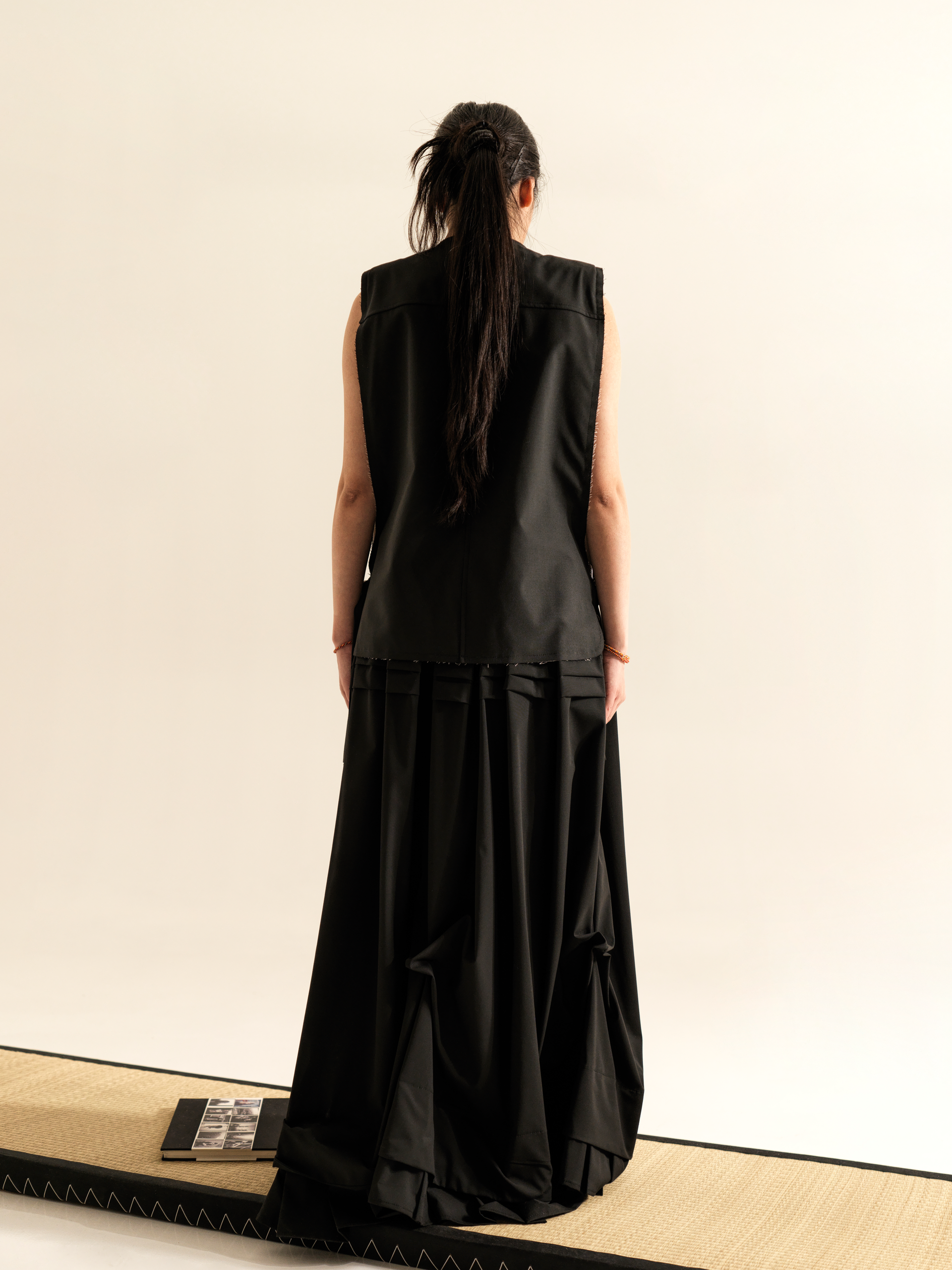 LONG SKIRT WITH SIDE DRAPING AND PLATED RUFFLE HEM