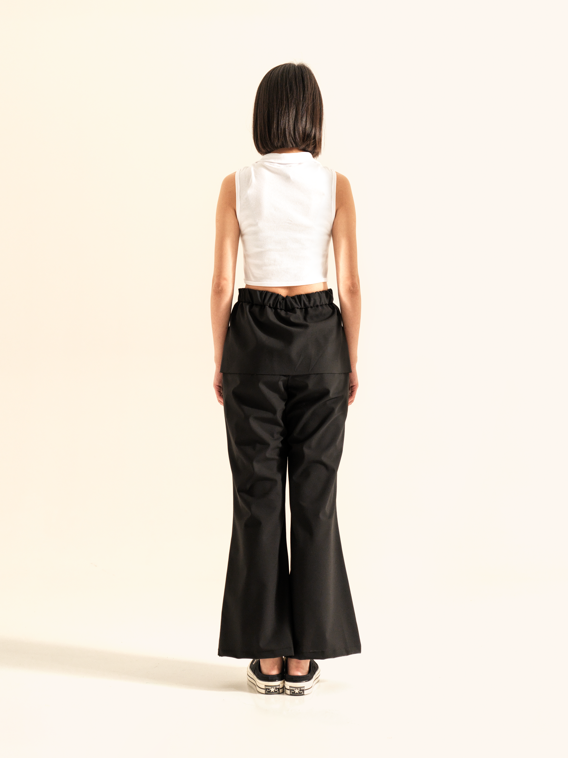 TROUSERS WITH FAKE SKIRT OVERLAYED