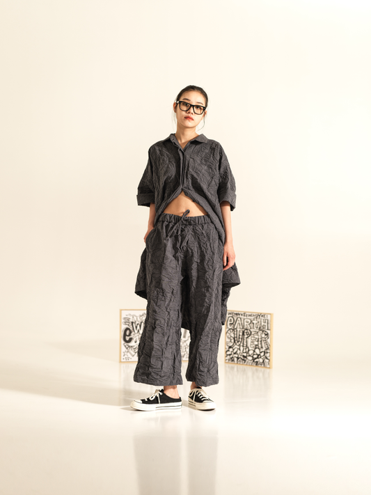 WRINKLED EFFECT TROUSERS WITH FRONT PLEAT