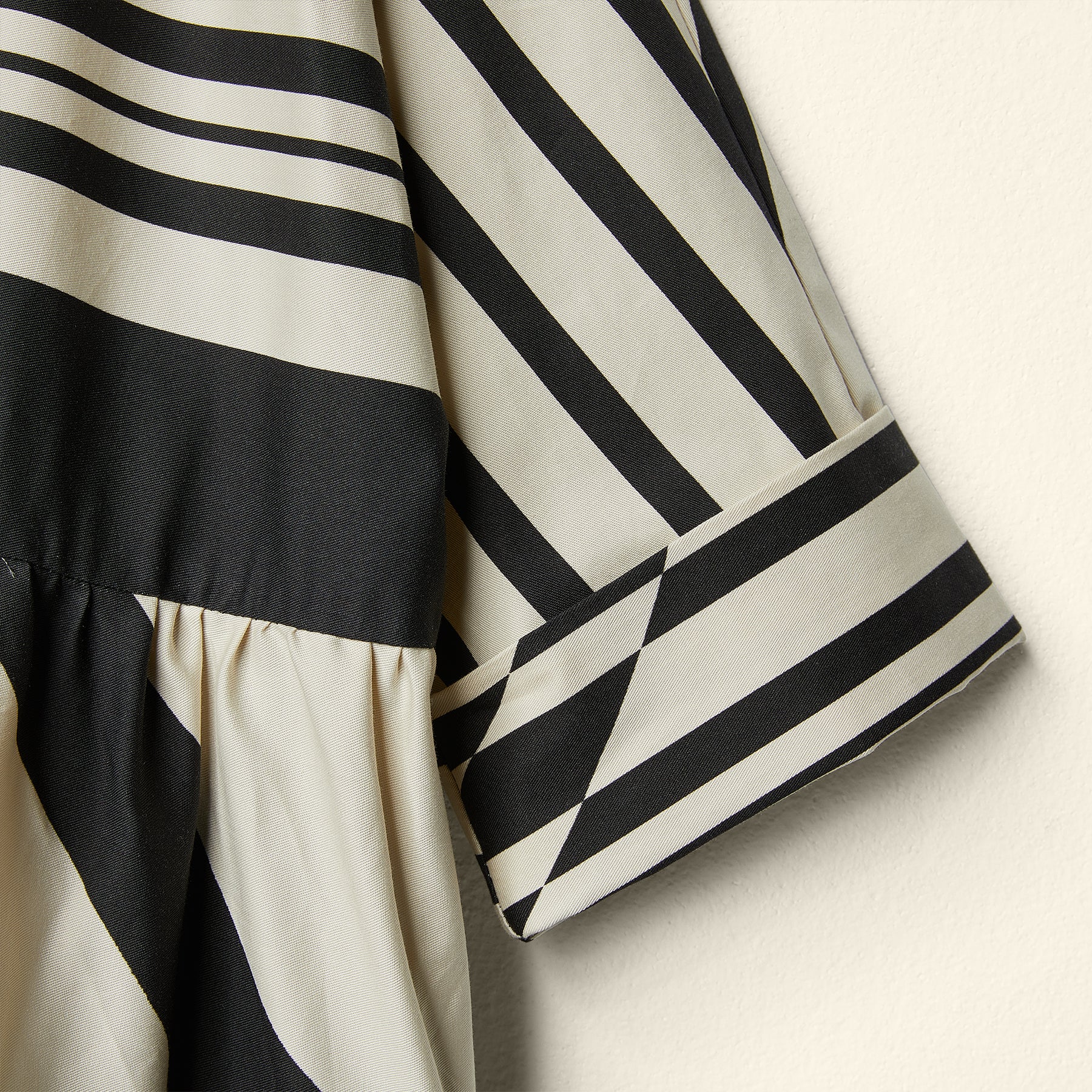 DRESS IN IRREGULAR STRIPED FABRIC