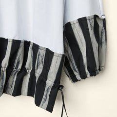 BLUSA IN JERSEY CON ORLI A RIGHE