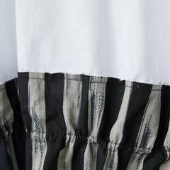BLUSA IN JERSEY CON ORLI A RIGHE