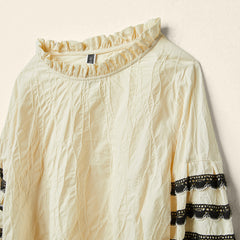 BLUSA CON PASSAMANERIA SULLE MANICHE