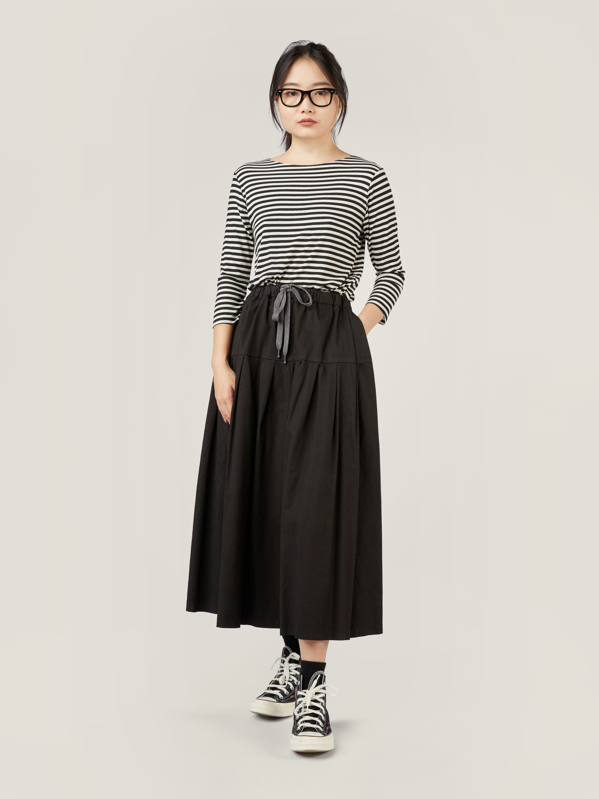 PLEATED SKIRT WITH SMOOTH YOKE